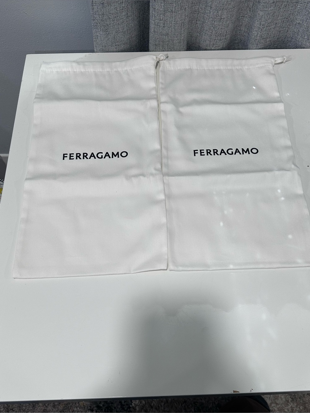 Two authentic Ferragamo White Dust Bag with Black Logo